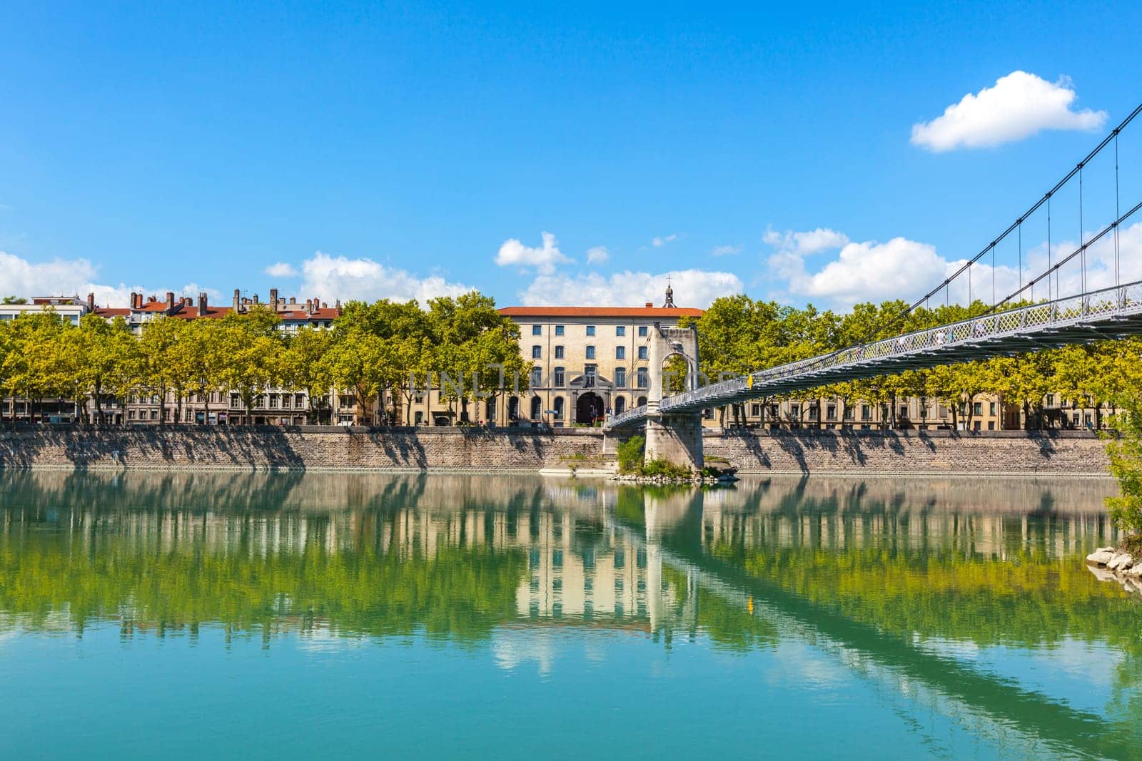 Cityscape of Lyon, France with reflections in the water. Summer day