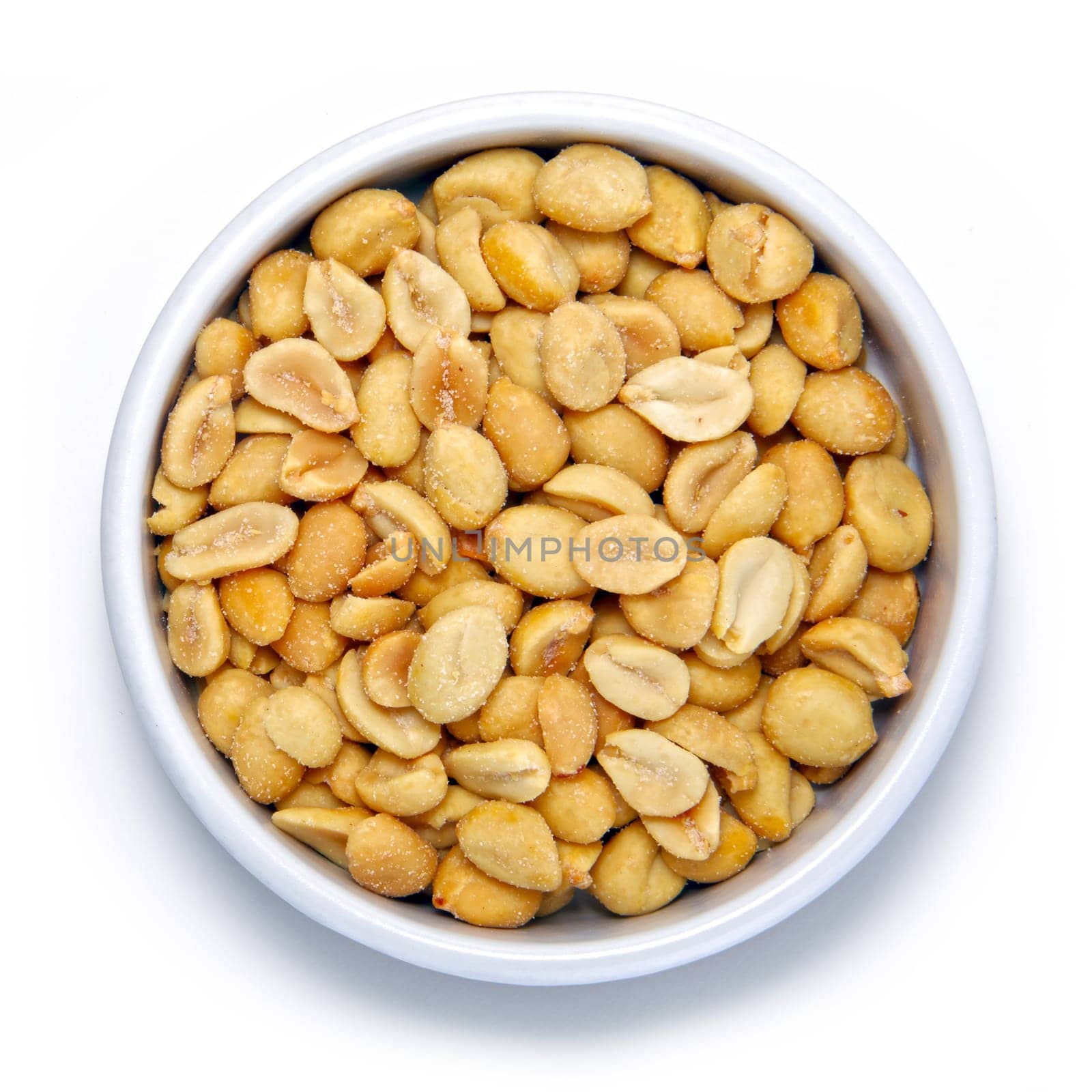 Salted peanuts in round container on a white background