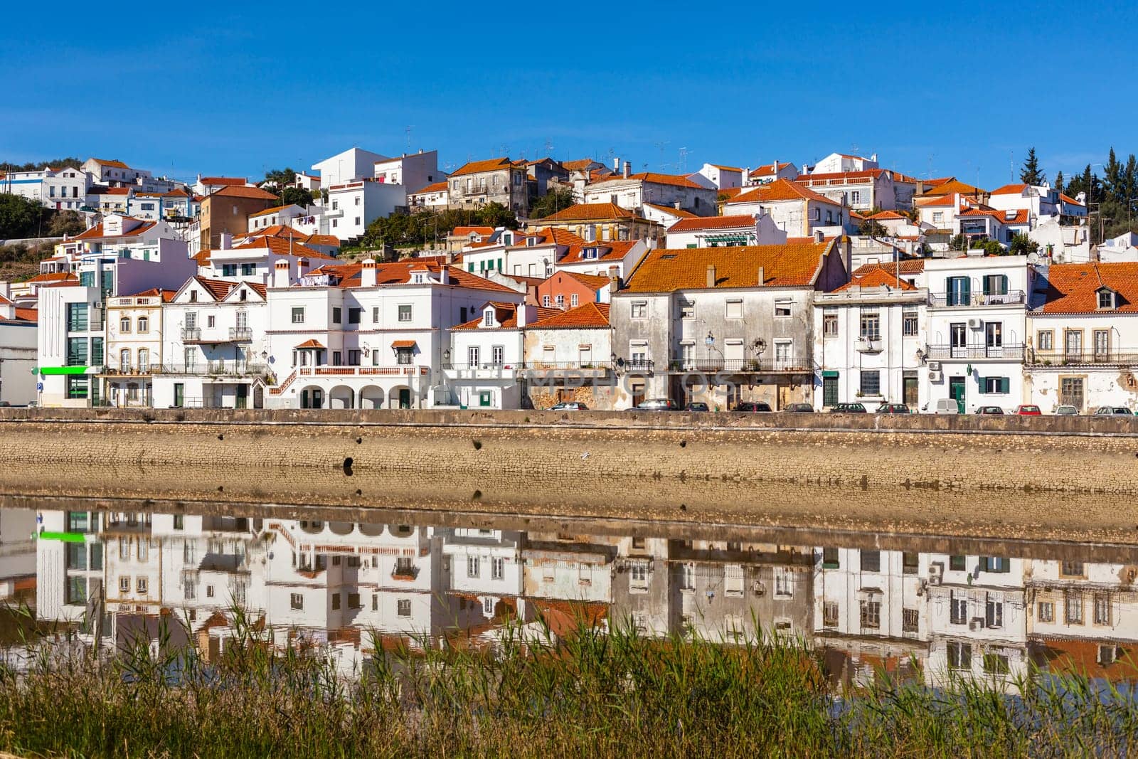 View of city Alcacer do Sal near the river Sado in Portugal. Horizontal shot