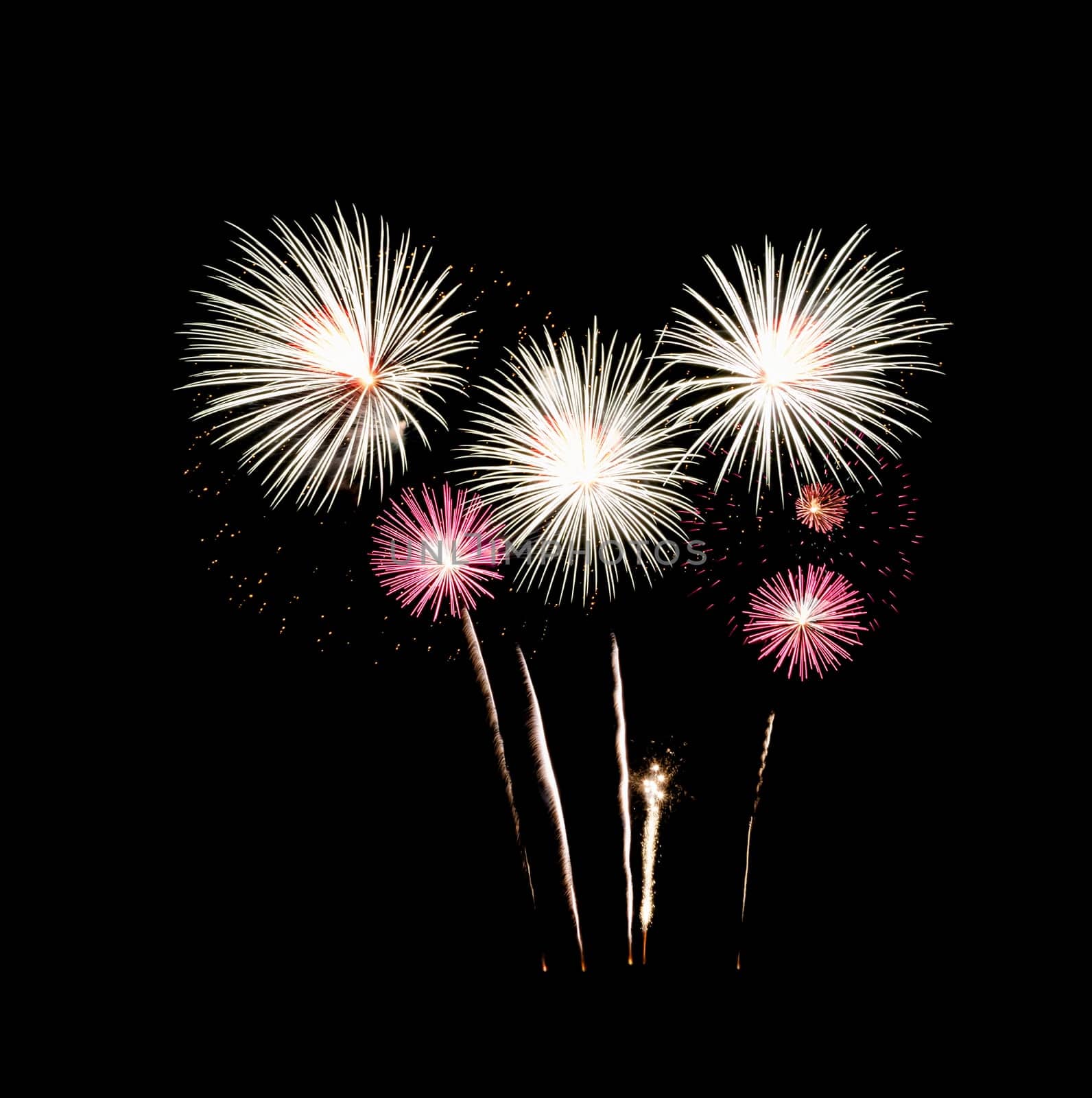 Festive fireworks exploding over night sky, isolated on black background