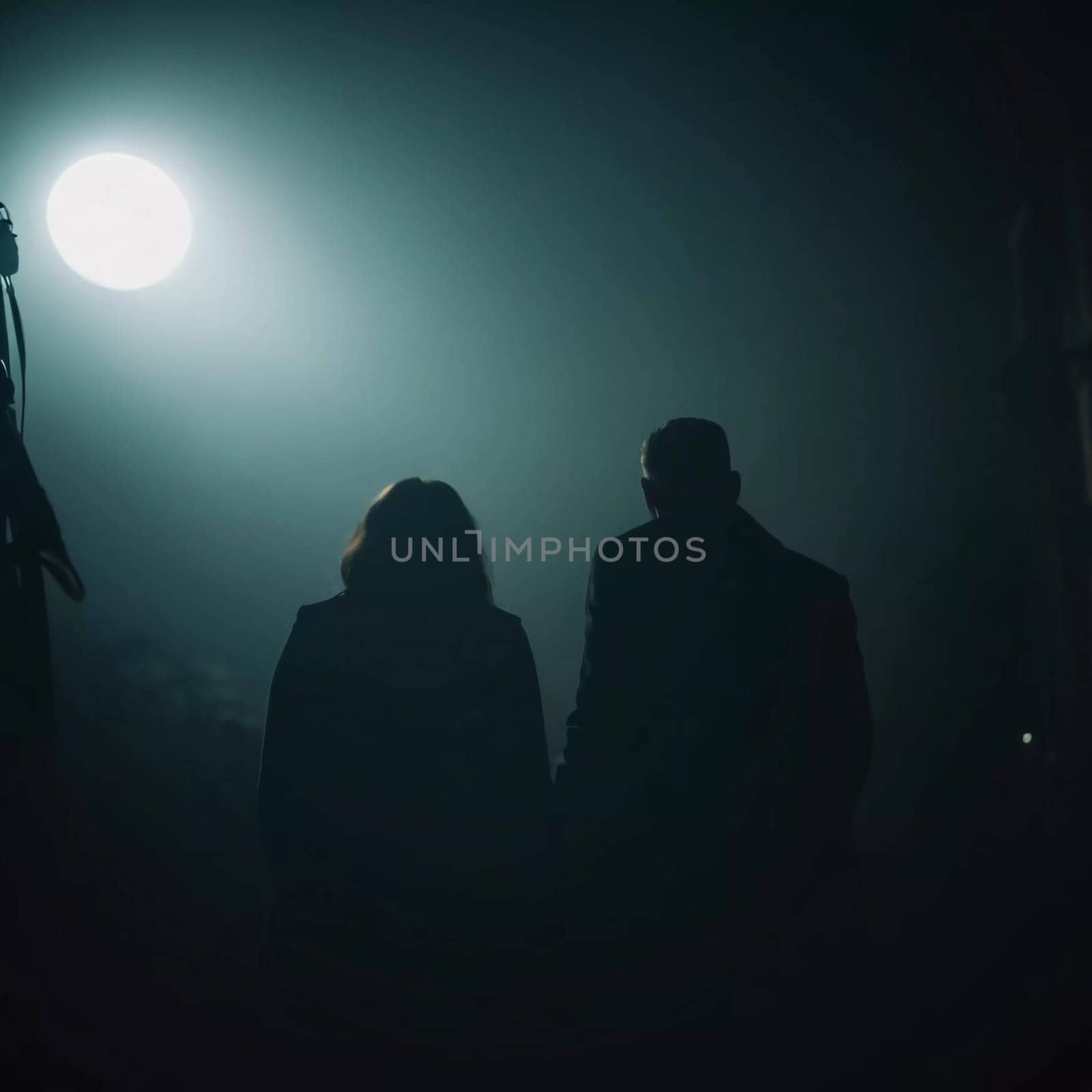 Two figures stand hand in hand, illuminated by a faint light, as they venture into the dark and foggy landscape filled with mysterious shadows. Generative AI.