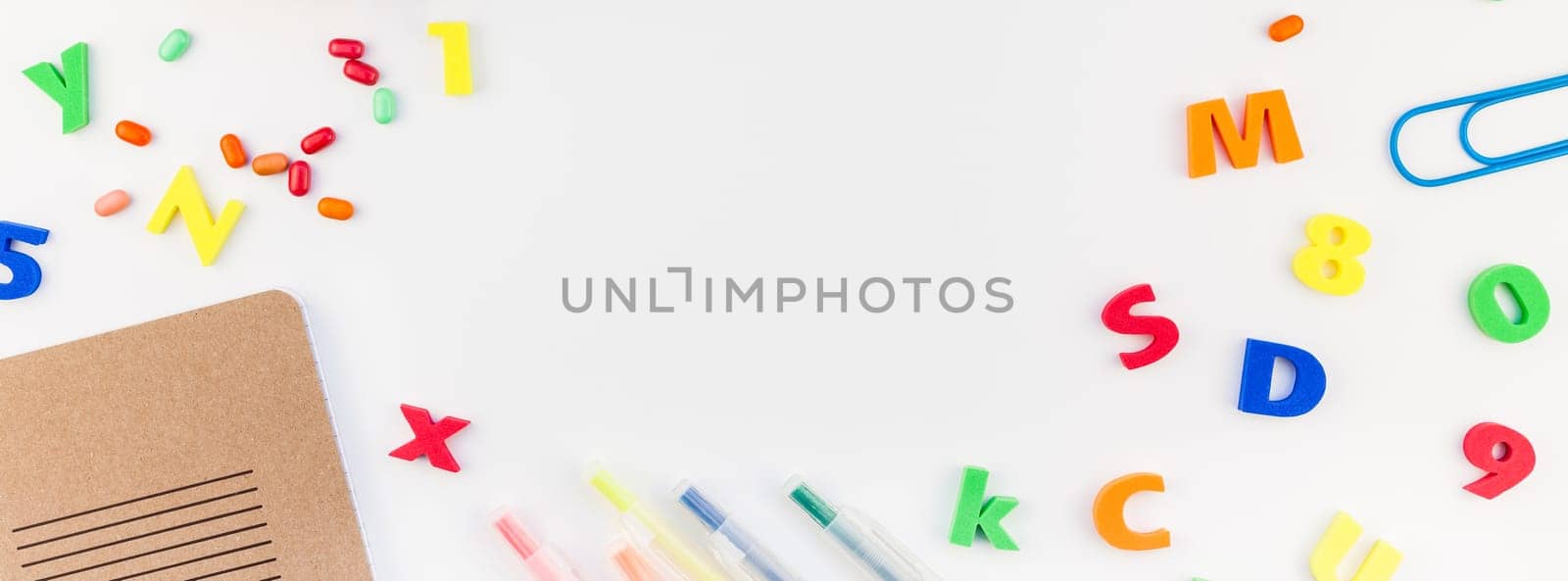 Long wide banner back to school concept with color school and office supplies on white table background with copy space, frame, template for text or design