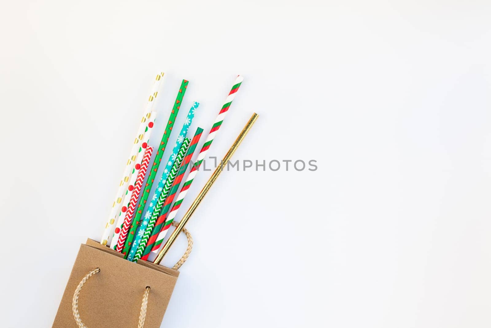 New Year or Christmas decoration flat lay top view Xmas holiday celebration shopping concept decor on white natural light background. Template frame for greeting card your design