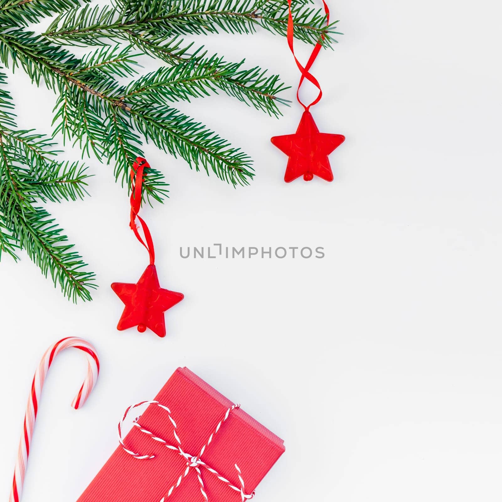 New Year Christmas Xmas 2020 holiday celebration red present gift box green fir tree branch copy space isolated white background minimal style. Square Template greeting card