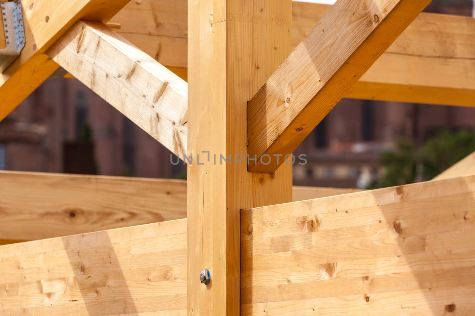 Construction of new wooden house. Beams frame close up
