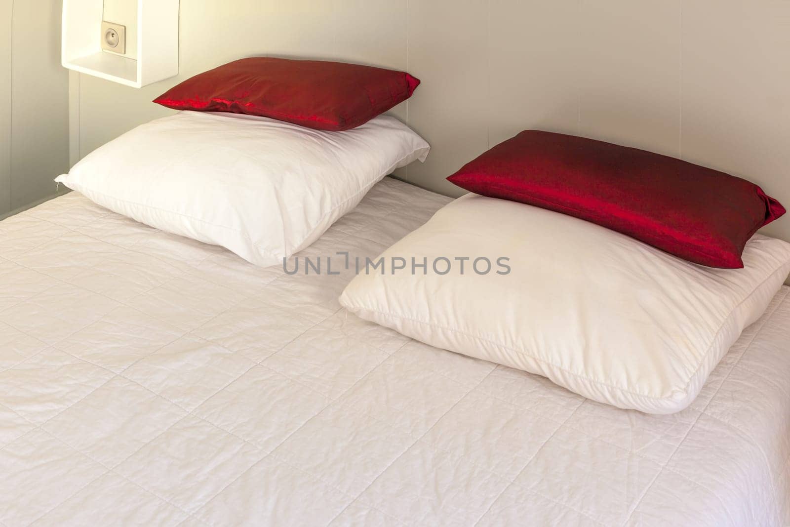 Prepared fresh bed, scene in apartments room. Horizontal shot