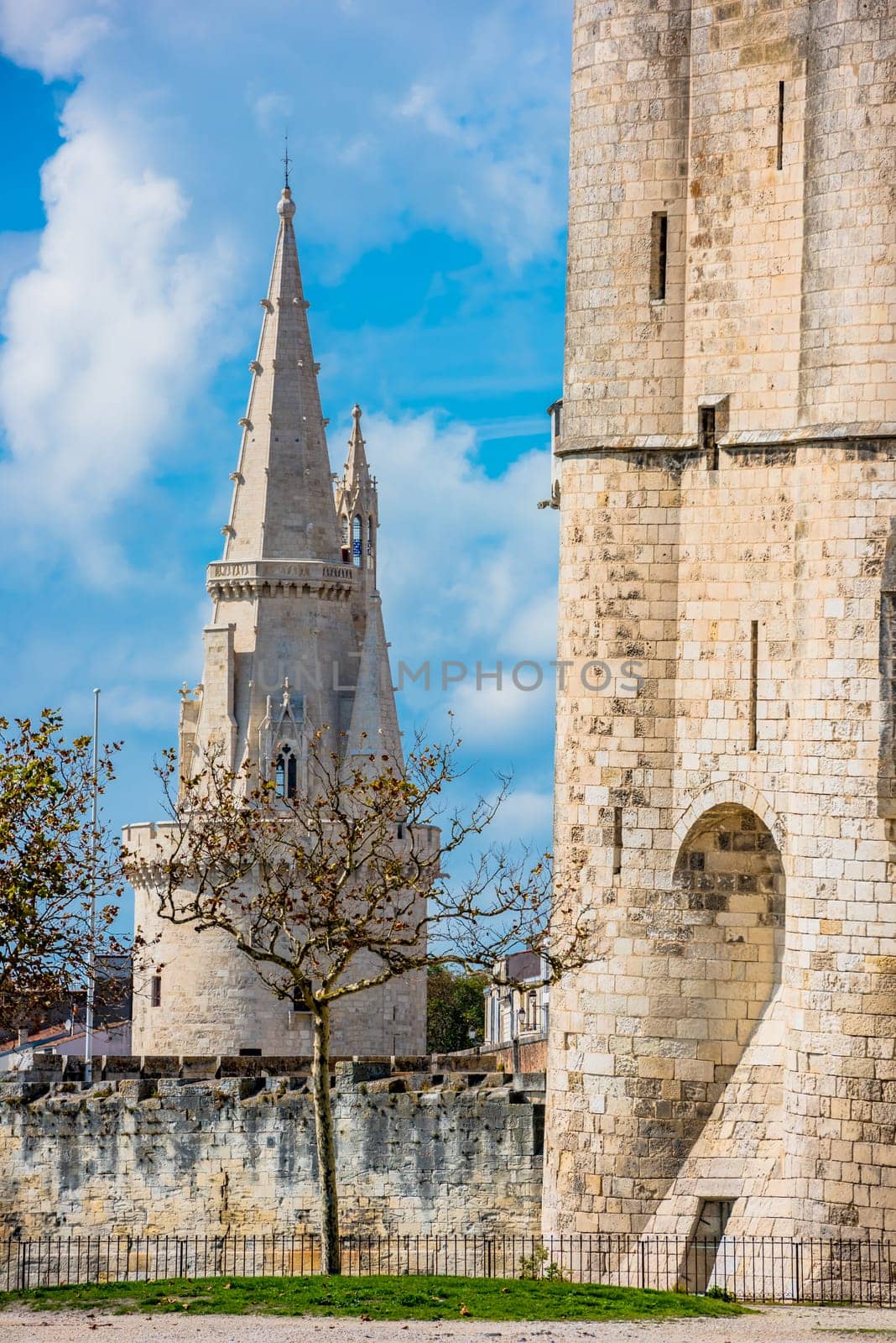 Old Harbour and Lantern towers of ancient fortress of La Rochelle France. Bright blue sky background