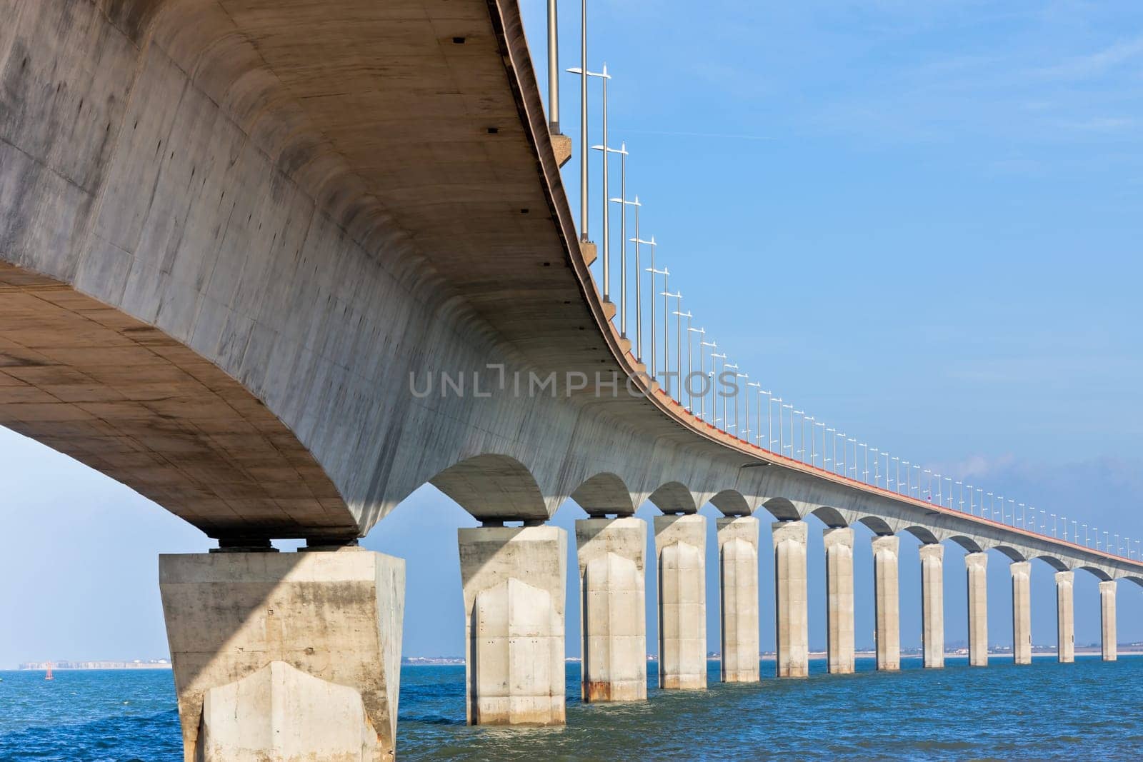 Curved Concrete Bridge over the water. Horizontal shot
