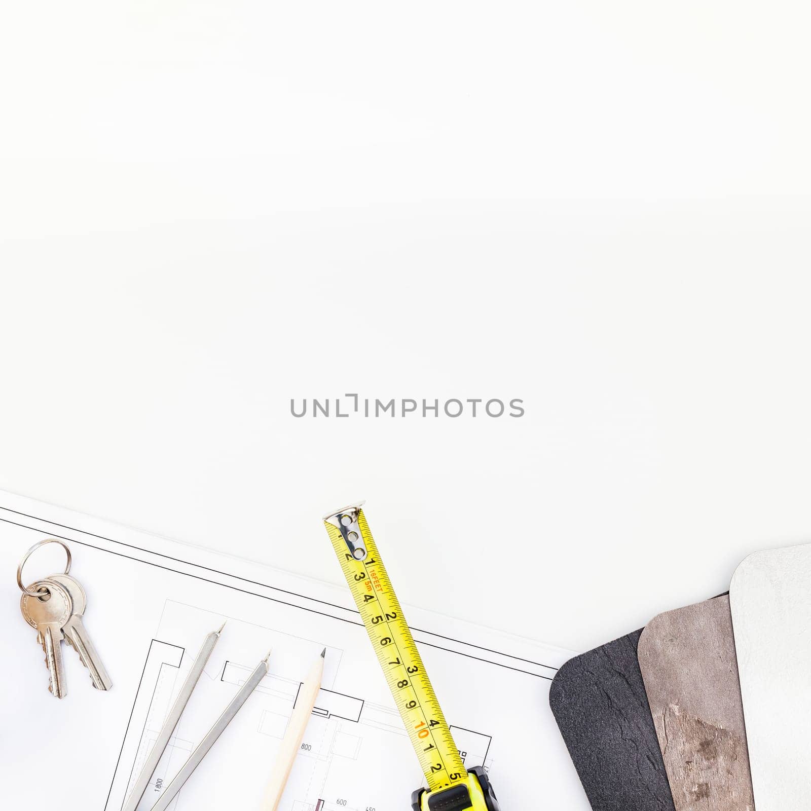Creative flat lay overhead top view blueprint flat project plan and office supplies on decorator table workspace swatches tools and equipment background copy space concept