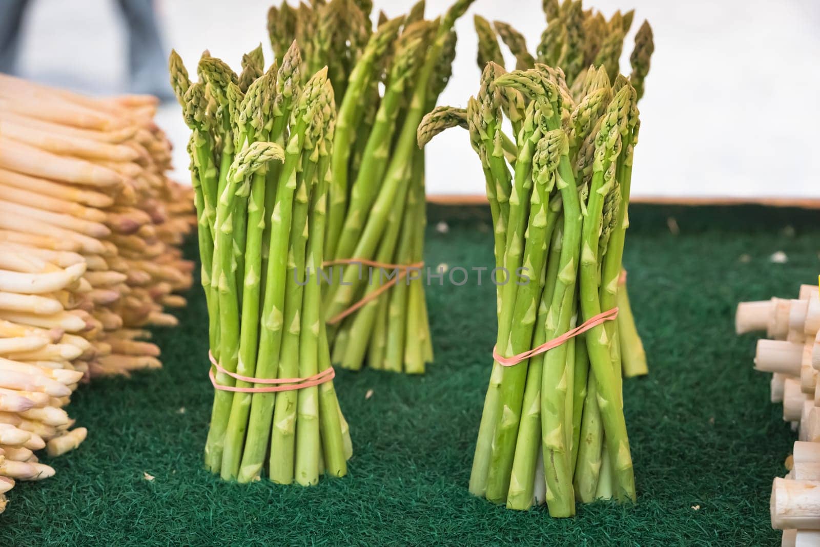 Fresh asparagus selling in a farmers market. Shot with a selective focus