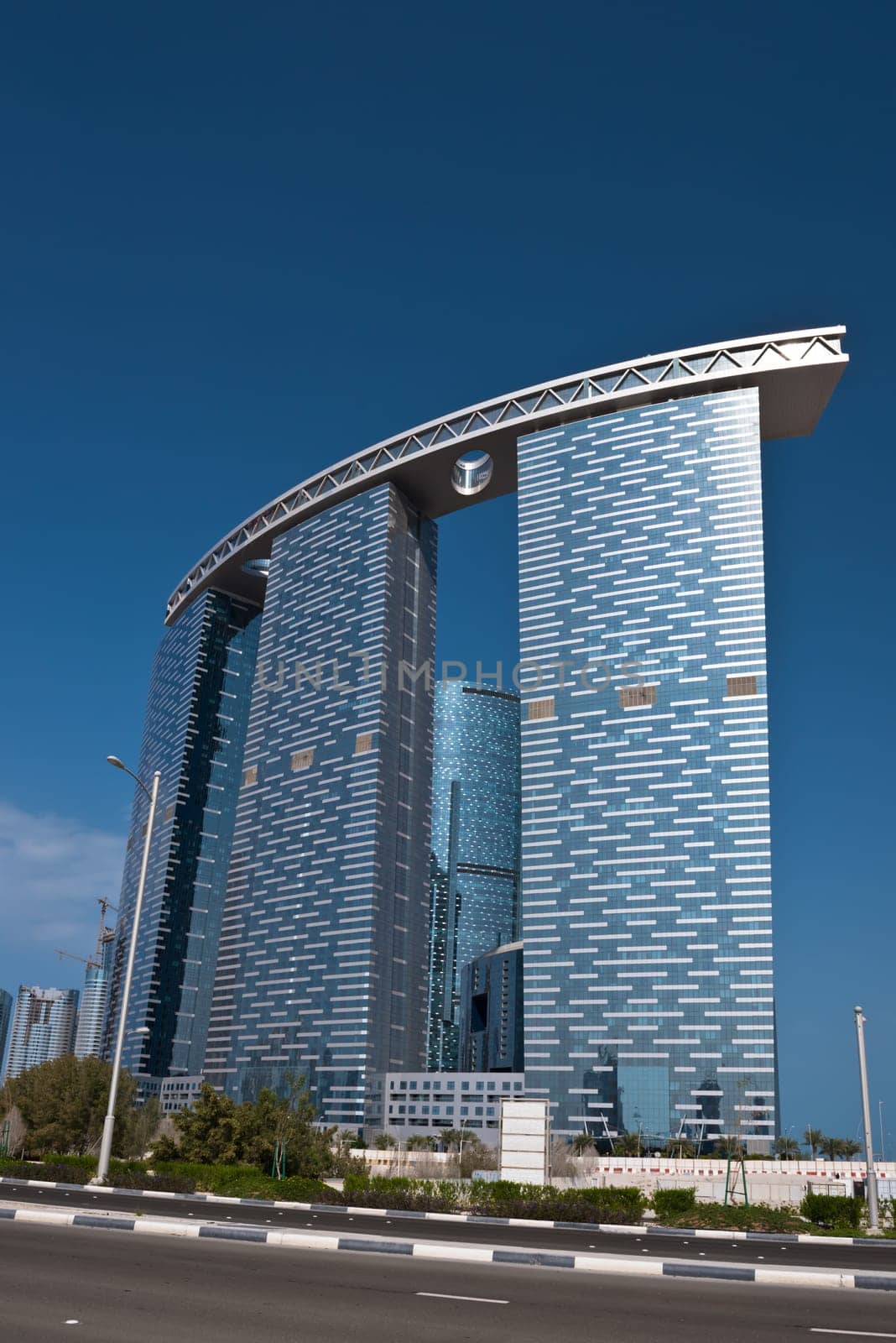 ABU DHABI, UAE - DECEMBER 24: Abu Dhabi streets with The Gate Towers skyscrapers on December 24, 2014. United Arab Emirates