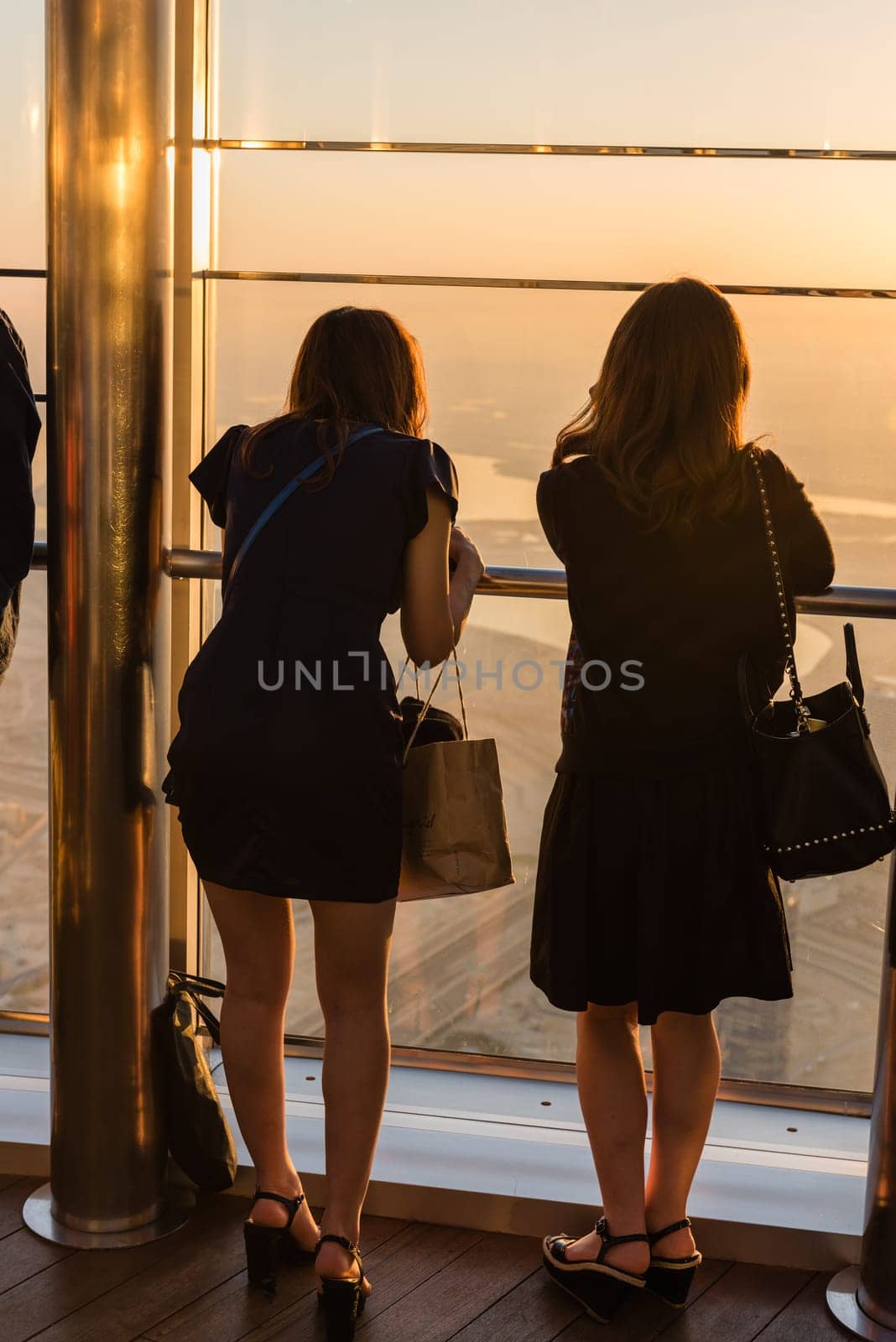 DUBAI, UAE - JANUARY 02: people at the top the observation deck of the highest building in the world Burj al Khalifa on January 02, 2015 in Dubai, United Arab Emirates