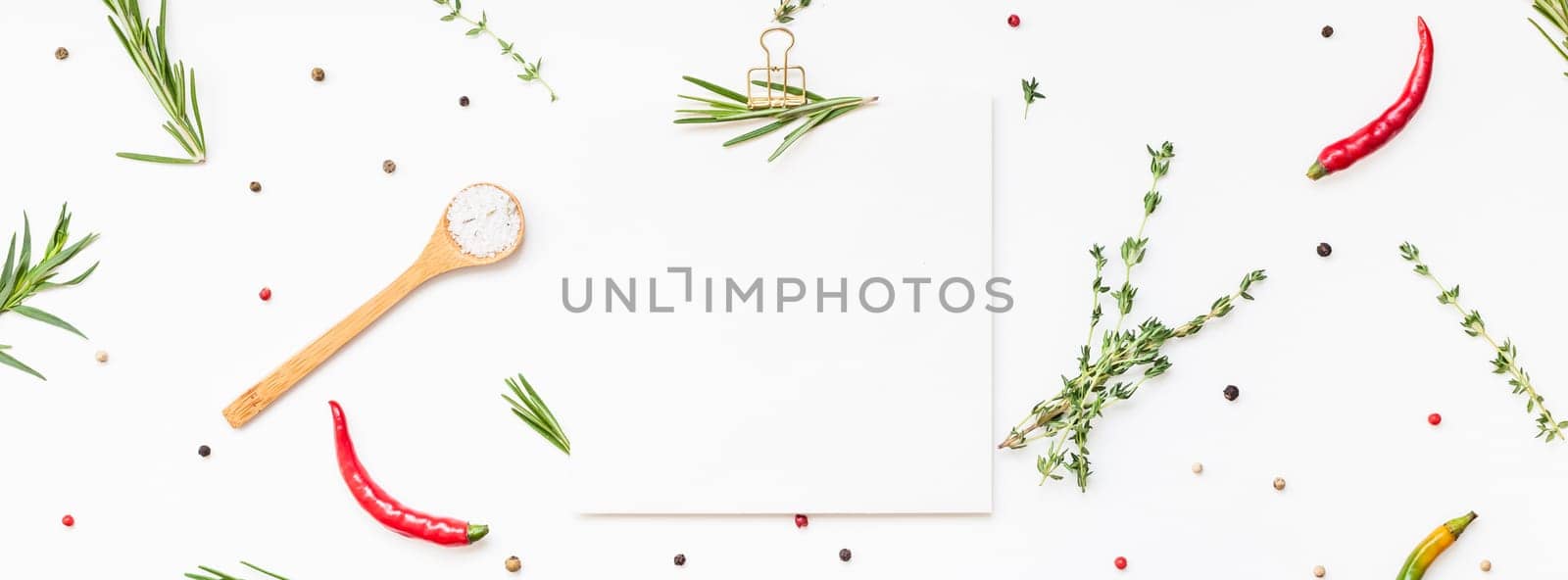 Flat lay overhead view blank recipe paper page with clip mockup text space invitation card on white background with greens herbs and spices. Menu recipe book food blog design with cooking ingredients