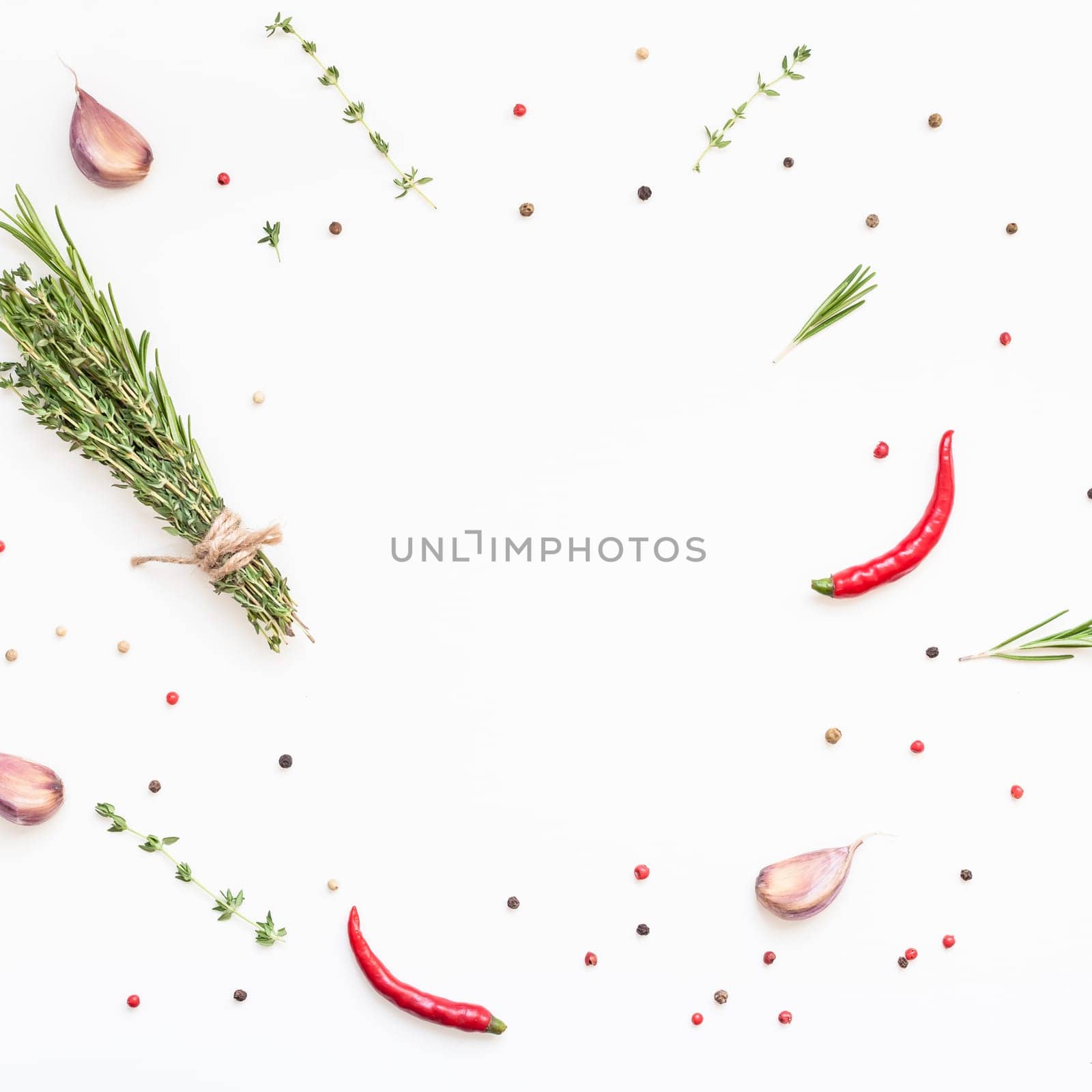Flat lay overhead top view of greens herbs and spices on white background with copy space. Menu frame design food pattern background with cooking ingredients
