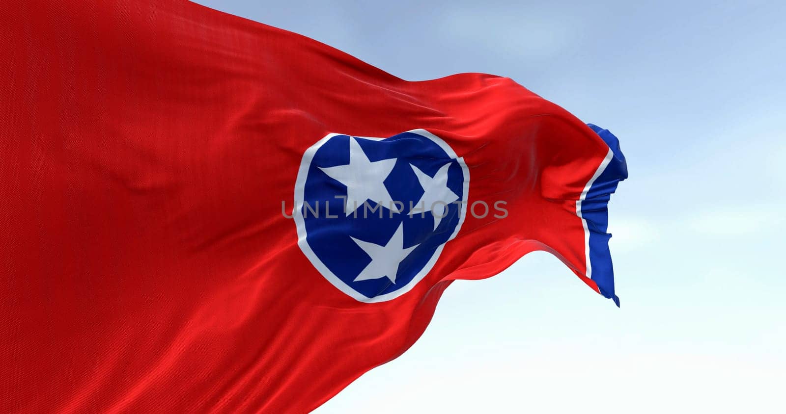 Close-up of the Tennessee state flag waving. Red field with a blue circle in the center containing three white stars. US state flag. 3d illustration render. Fluttering fabric. Selective focus
