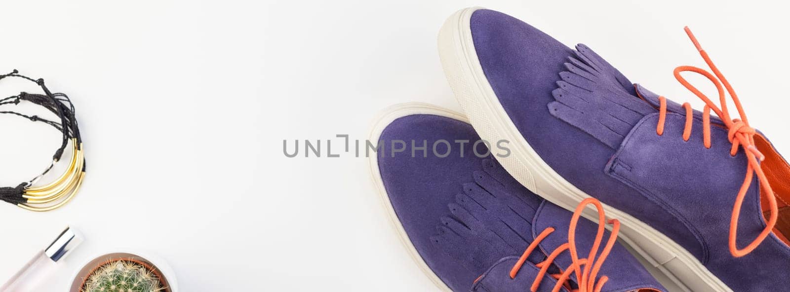 Long wide banner Flat lay of trendy suede shoes, female accessories and cactus on white background with copy space. Overhead view of woman casual outfit. Trendy hipster look top view