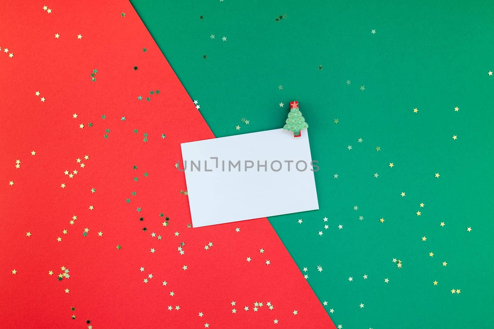 Creative New Year or Christmas greetings letter mockup flat lay top view Xmas holiday celebration envelope on red green paper background. Template mock up greeting card or your text design 2019 2020