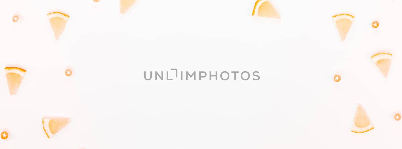 Long wide banner top view citrus lemon slices pattern frame white table background with copyspace. Hot summer refreshment lemonade concept. Beverage ingredients arranged