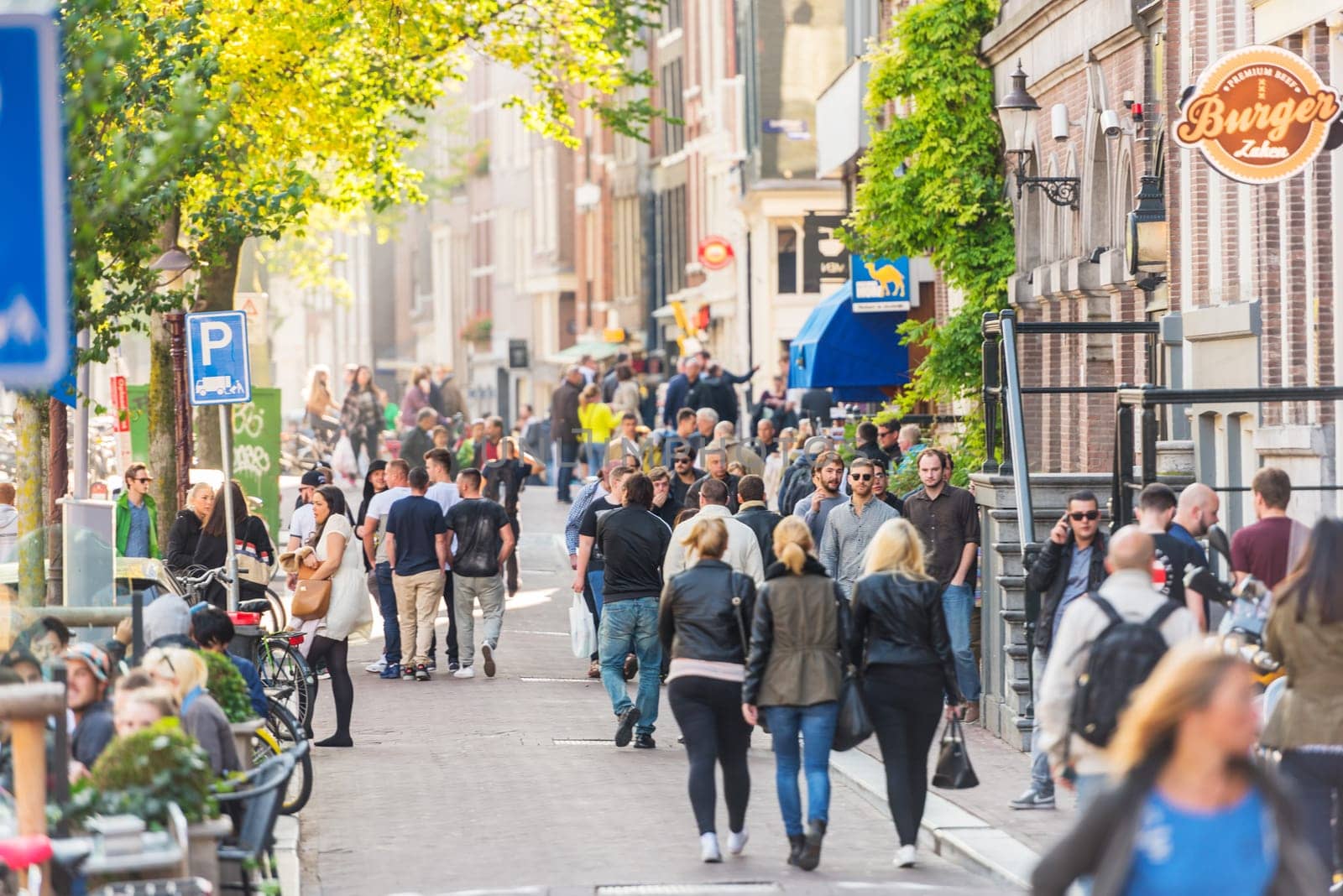 NETHERLANDS, AMSTERDAM - OCTOBER 2: people walking on the street of Amsterdam on October 2, 2015