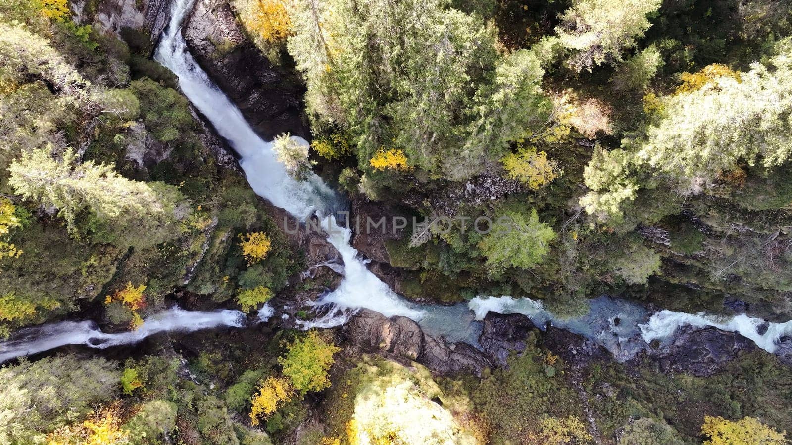 Drone shot of the Rotlech waterfall in Tirol in Austria in fall