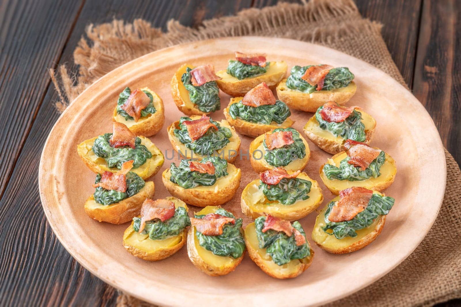 Roasted baby potatoes with creamy spinach and bacon