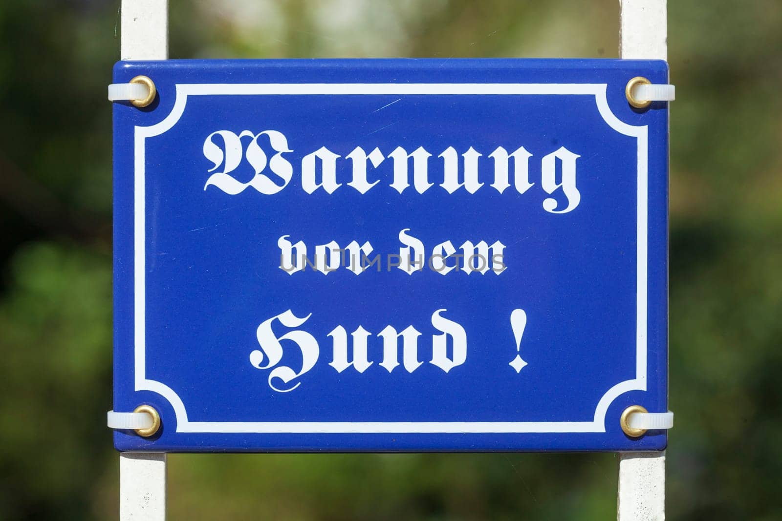 Dog warning sign, Biting dog on a garden fence, Germany