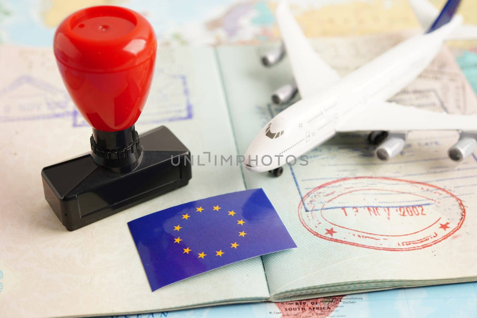 EU  flag on passport with airplane for travel.