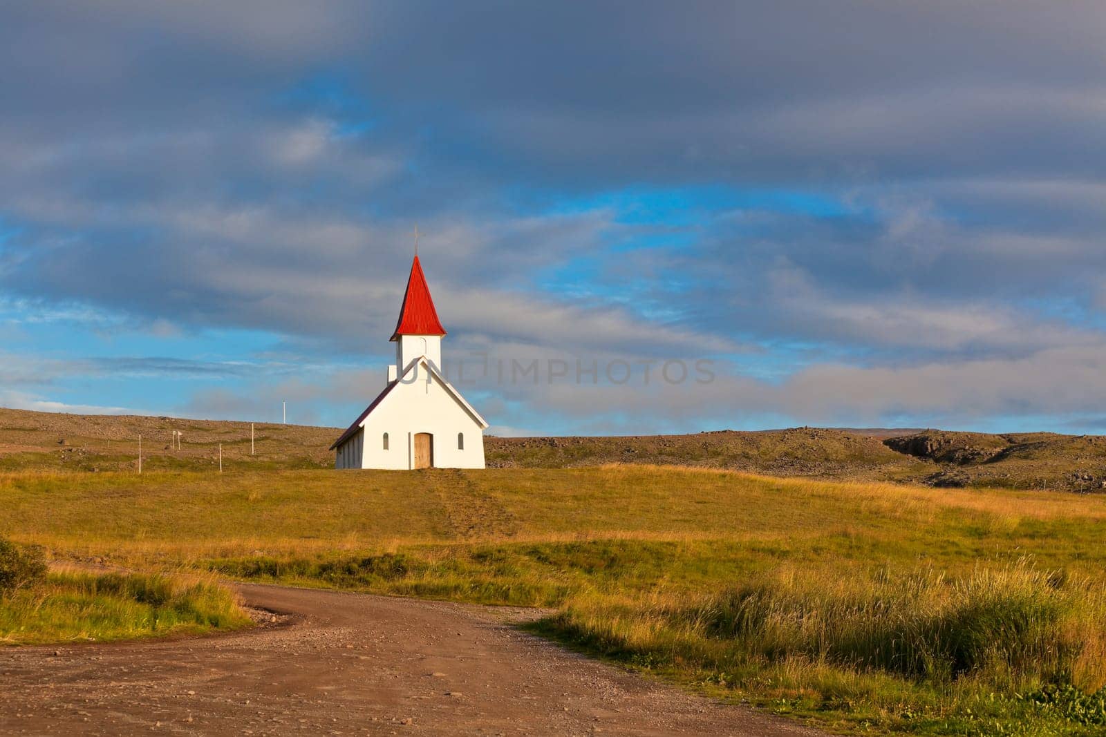 Typical Rural Icelandic Church under a blue summer sky. Horizontal shot
