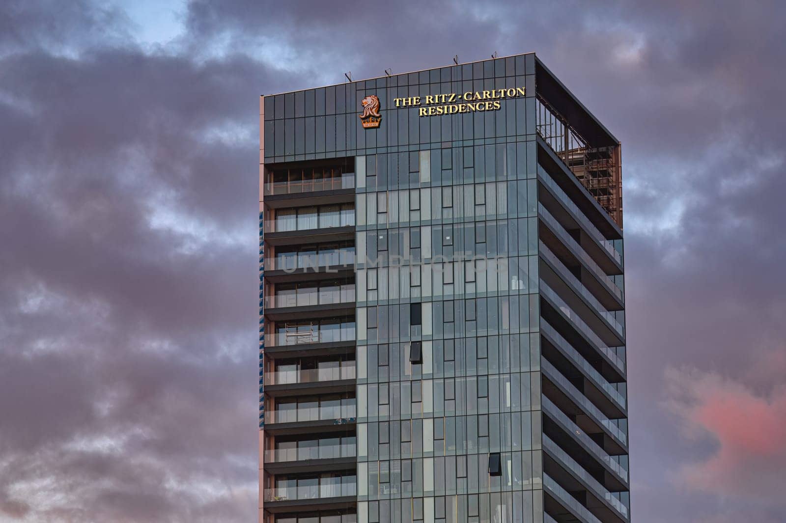 Limassol, Cyprus - January 14, 2024: The modern and luxurious Ritz-Carlton residences building standing tall against a dramatic cloudy sky in Limassol, Cyprus
