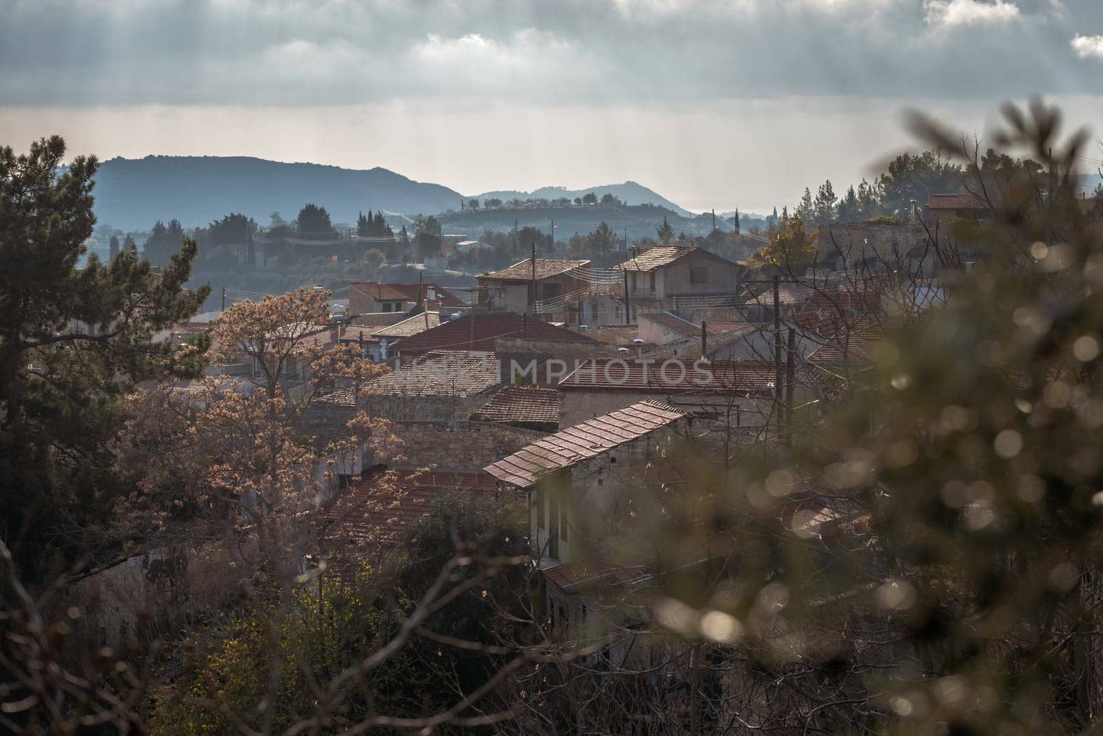 Traditional houses with red tiled roofs in Vouni village are blending with the landscape of Cyprus. Limassol District, Cyprus