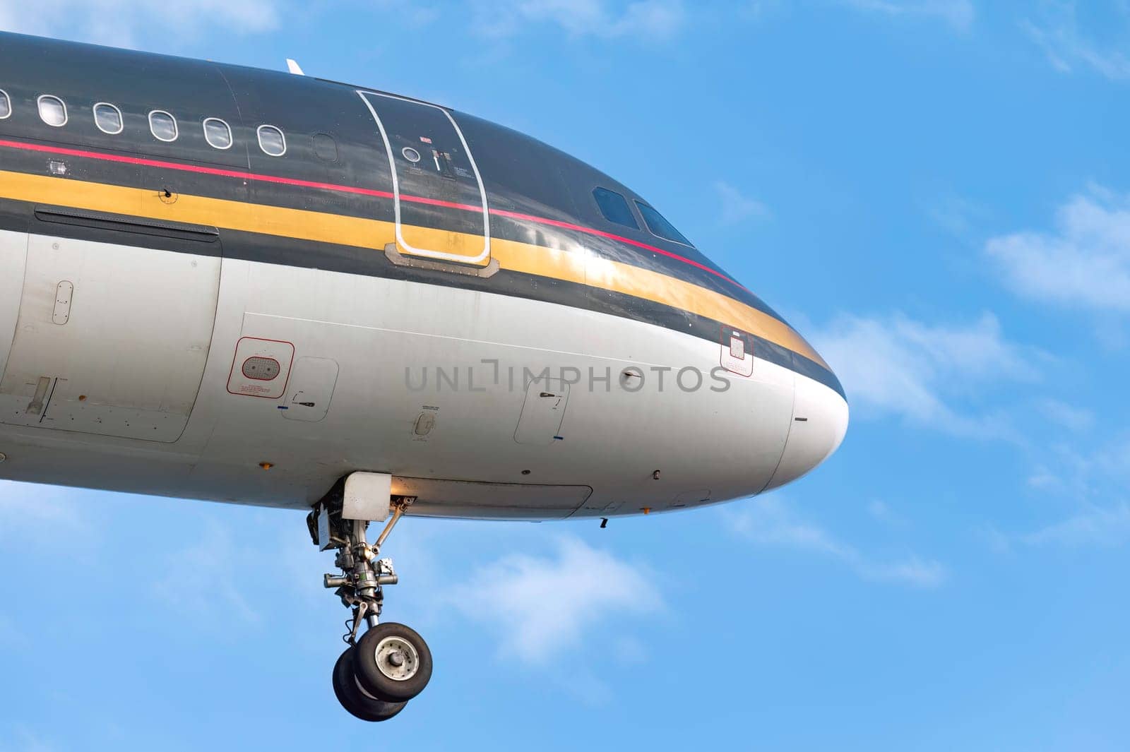 Large passenger airplane is approaching airport runway getting ready for landing