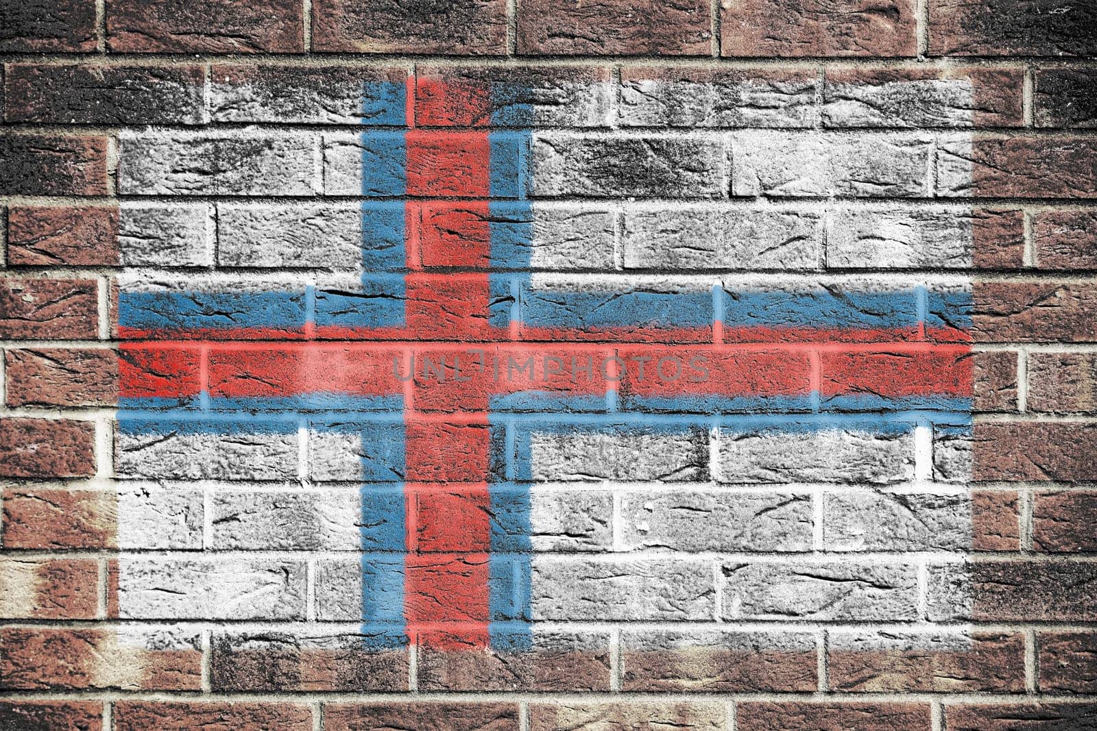 A Faroe Islands flag on brick wall background