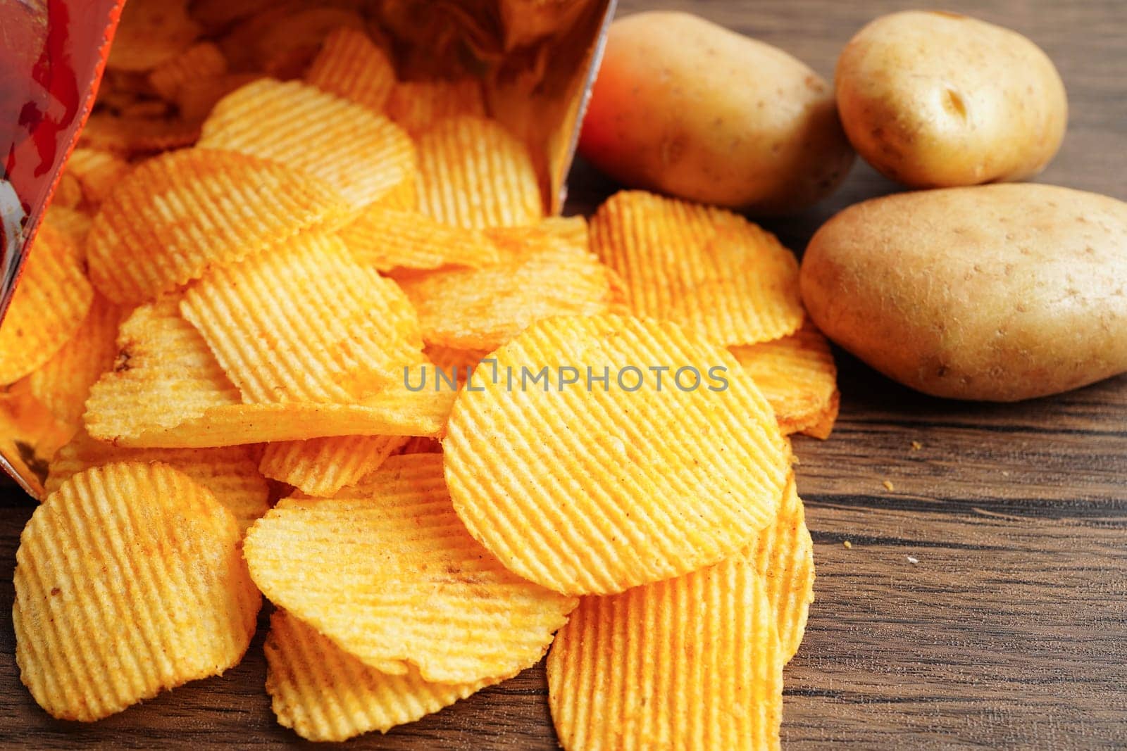 Potato chips , delicious BBQ seasoning spicy for crips, thin slice deep fried snack fast food.