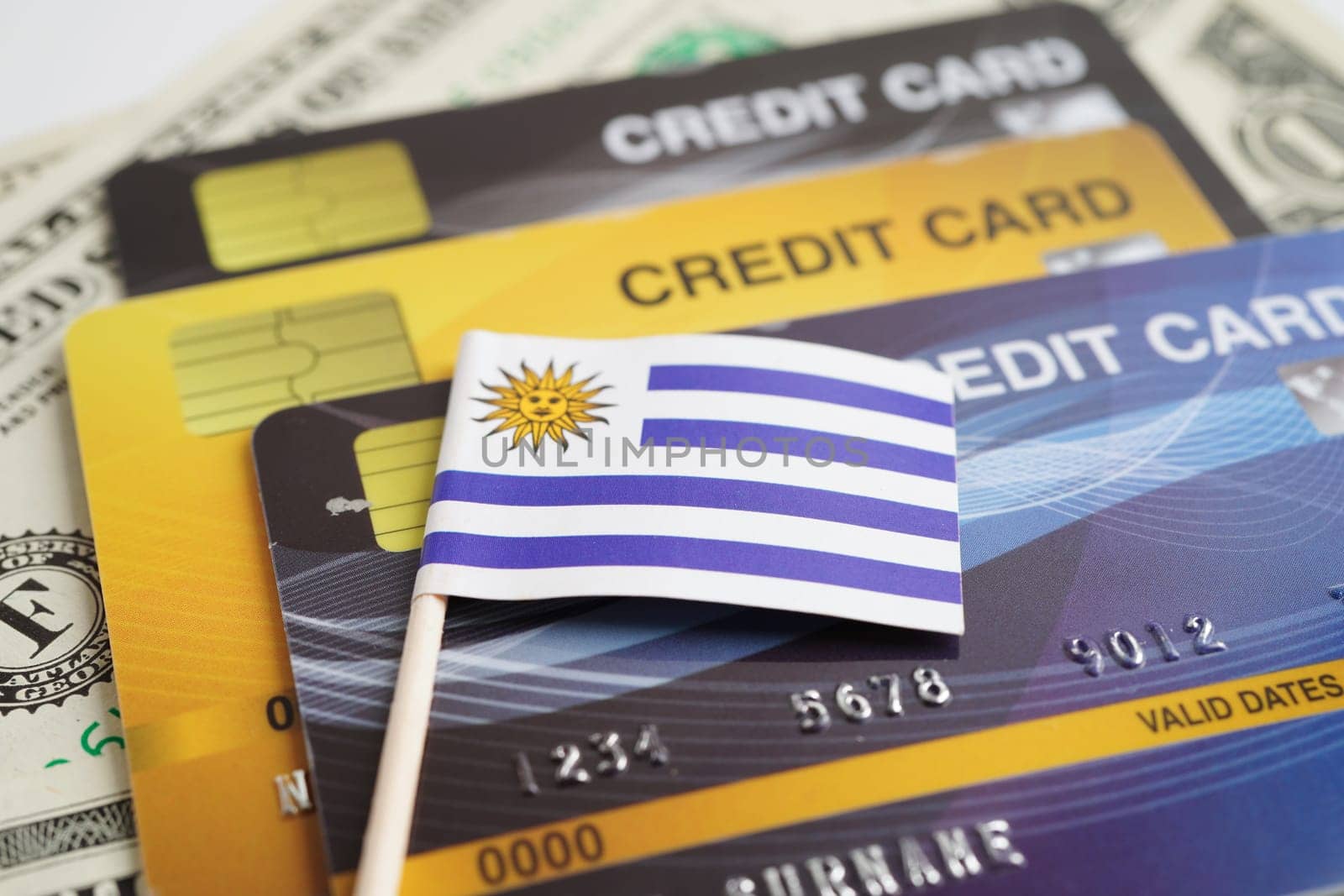 Uruguay flag on credit card, finance economy trading shopping online business.