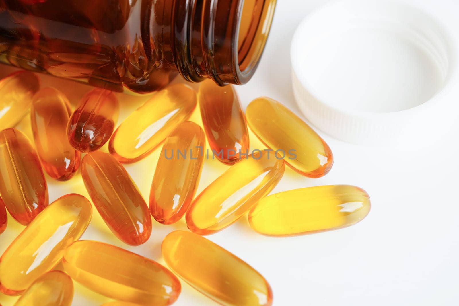 Fish oil or Cod liver oil gel in capsules with omega 3 vitamins, supplementary healthy food
