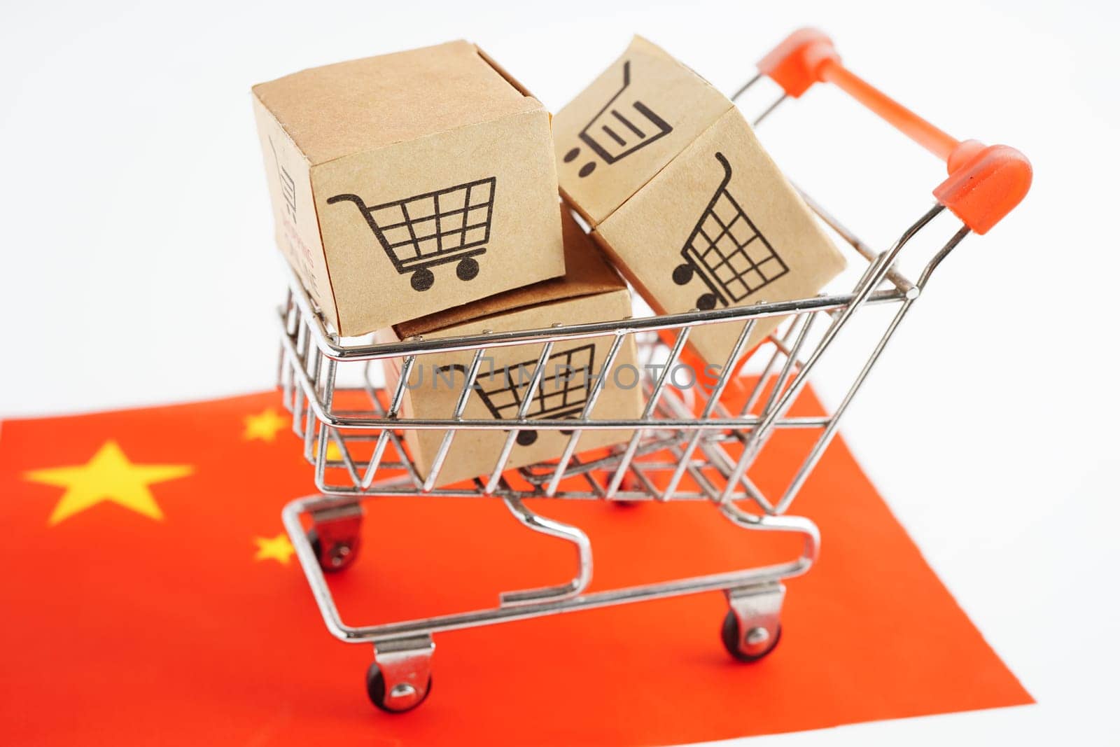 Online shopping, Shopping cart box on China flag, import export, finance commerce.