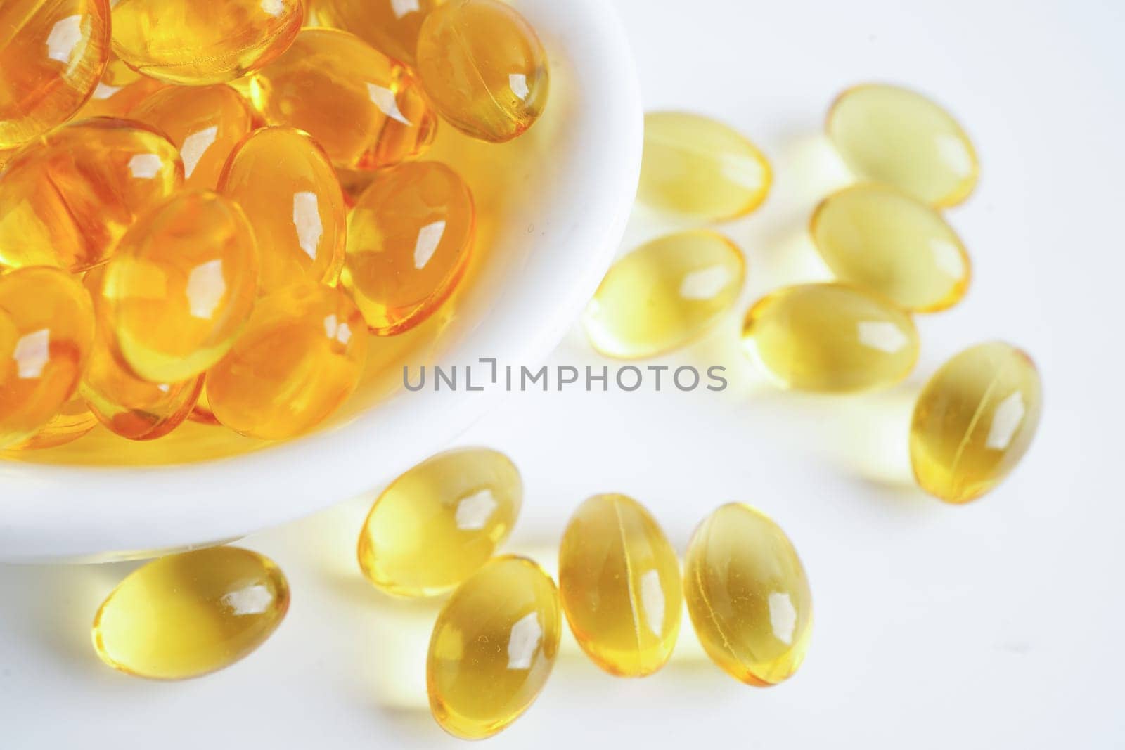 Fish oil or Cod liver oil gel in capsules with omega 3 vitamins, supplementary healthy food