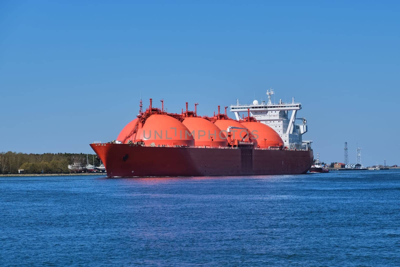 LNG or liquified natural gas tanker entering port on a sunny day in Klaipeda, Lithuania. Alternative gas supply, commercial freight, energy crisis