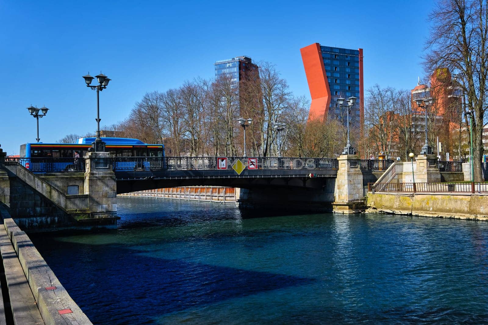 View of Birzos or Exchange bridge over river Dane in Klaipeda, Lithuania with a bus run across it