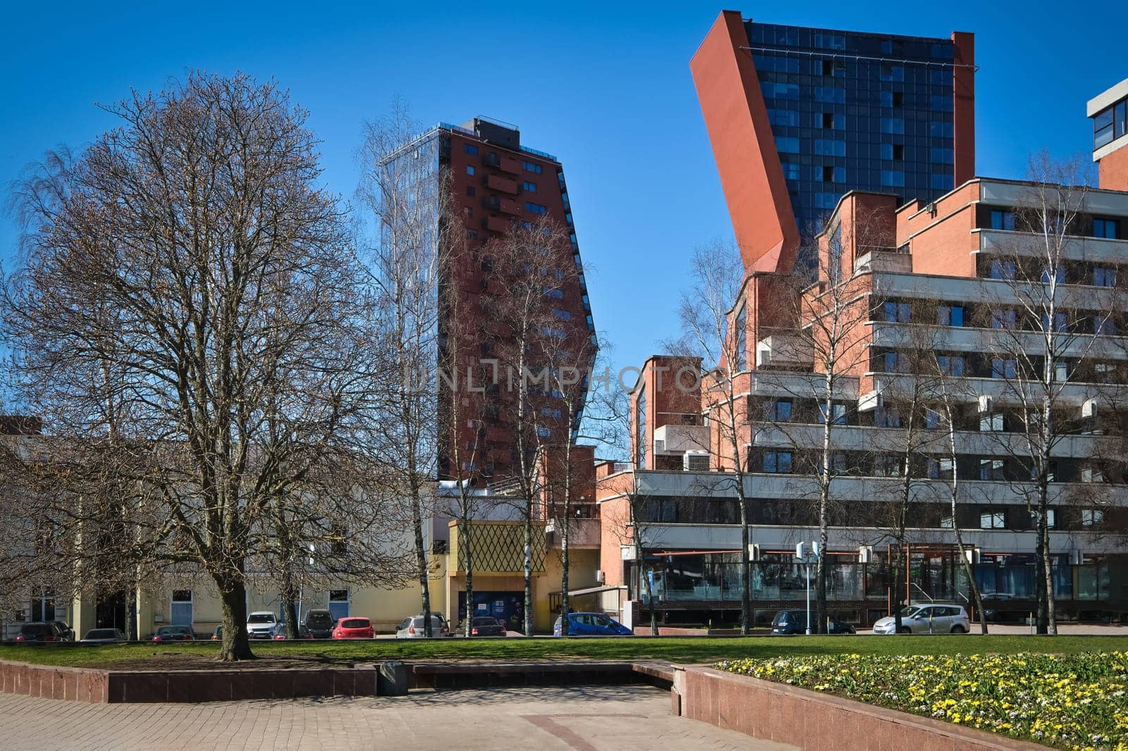 Modern and Soviet buildings in Klaipeda, Lithuania on sunny early spring day.