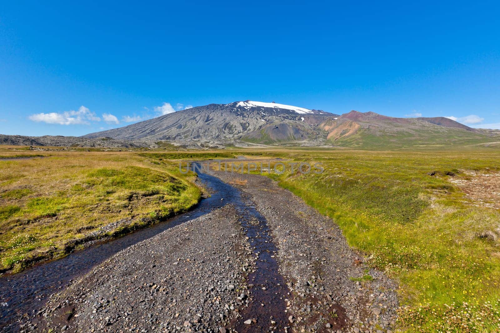 Summer Iceland Landscape with Mountains and Small River Stream. Horizontal shot