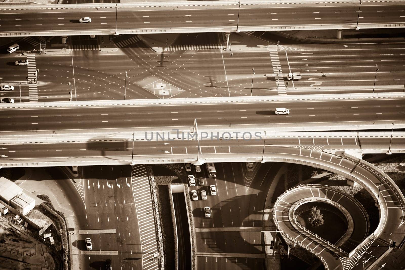 Top view of highway interchange in Dubai, UAE. Sepia toned