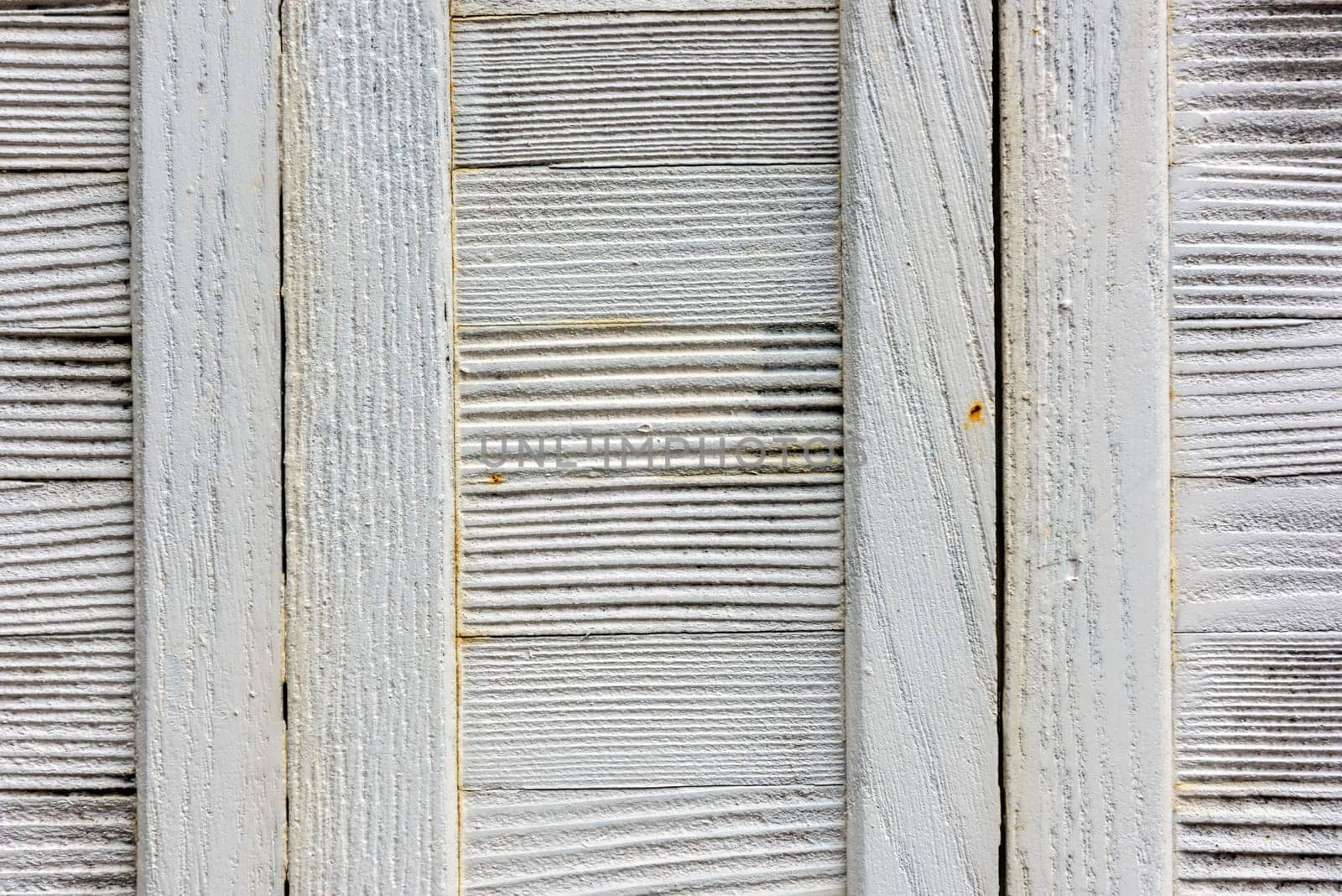 window with closed beige wooden shutters. background photo