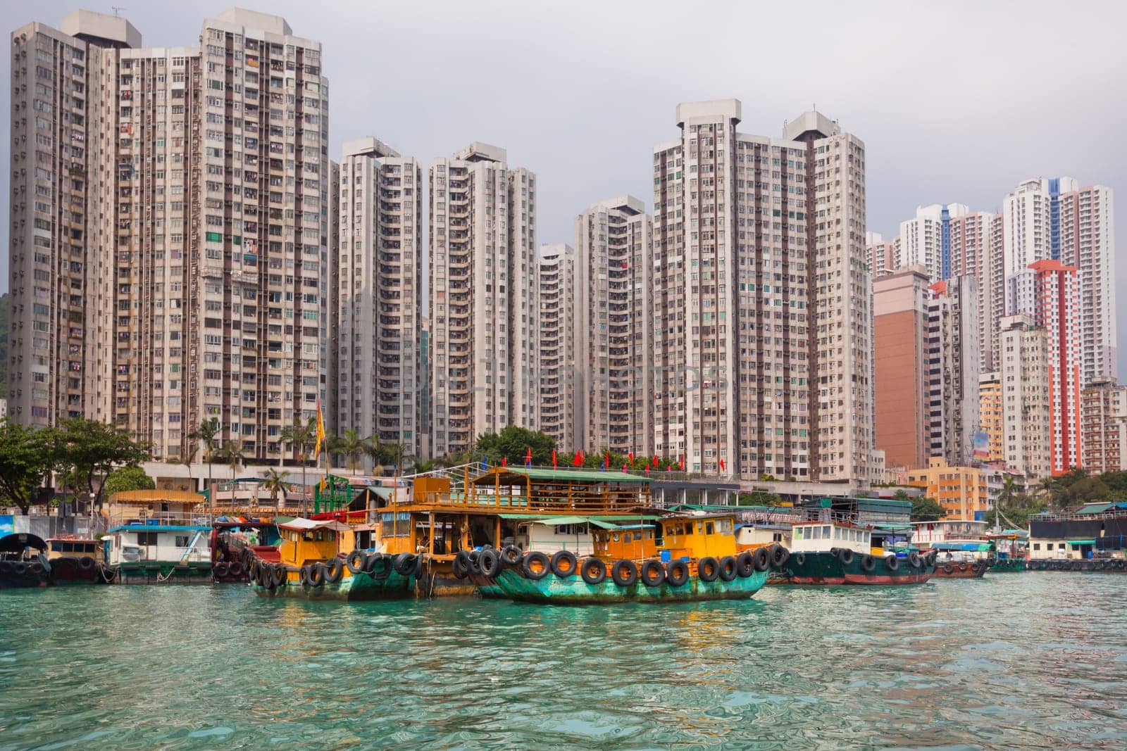 Traditional fishing trawlers in the Aberdeen bay, famous floating village in Hong Kong