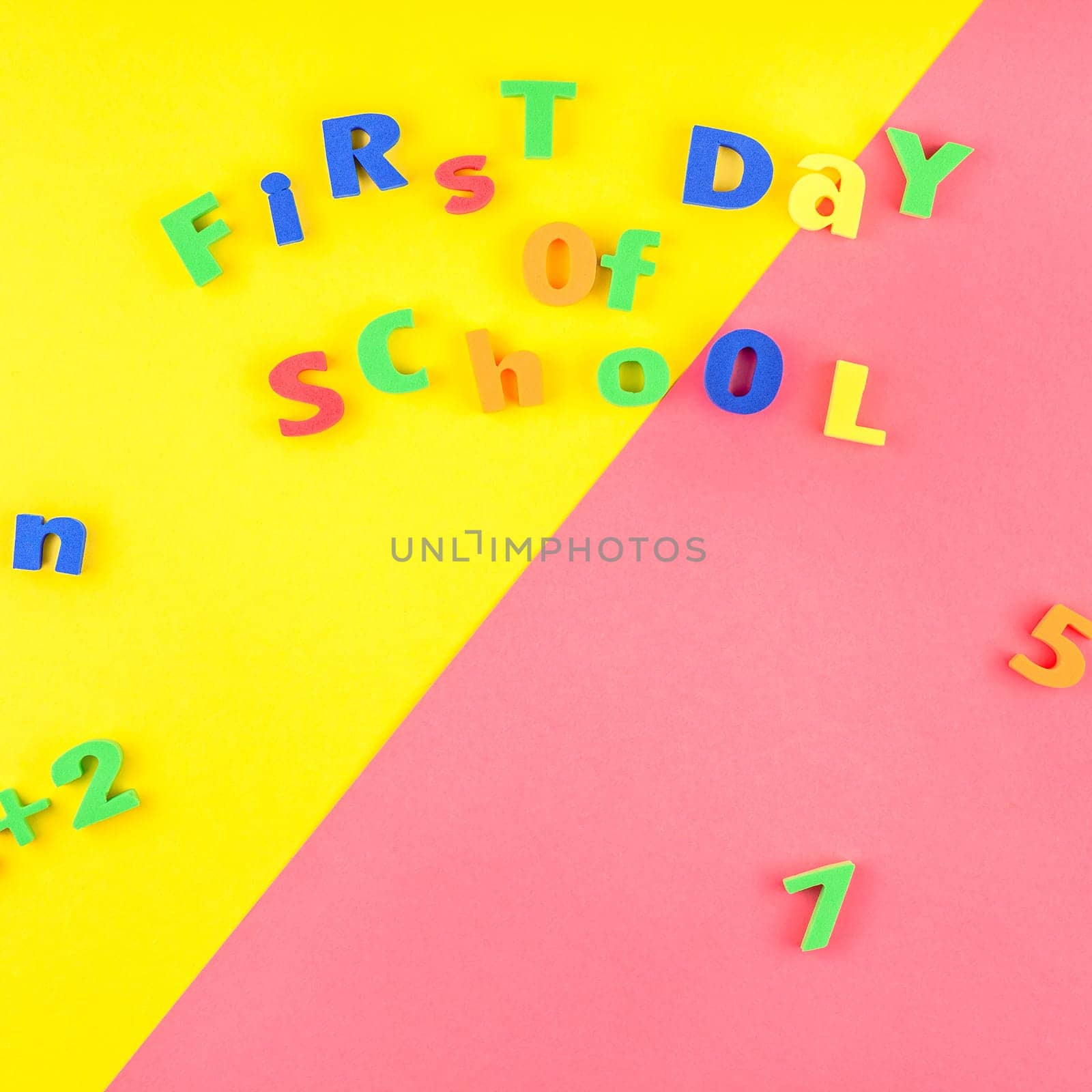 Square Creative flat lay back to school concept with welcome letters message on bright yellow and pink paper background with copy space, template for text or design