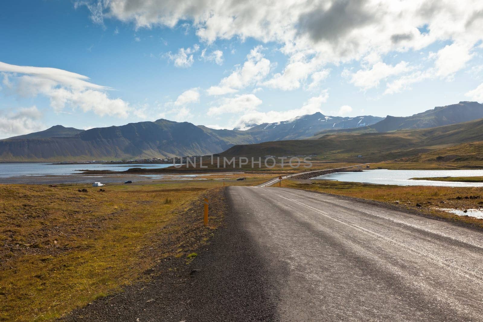 Curve Road through sea lagoon at Western Iceland