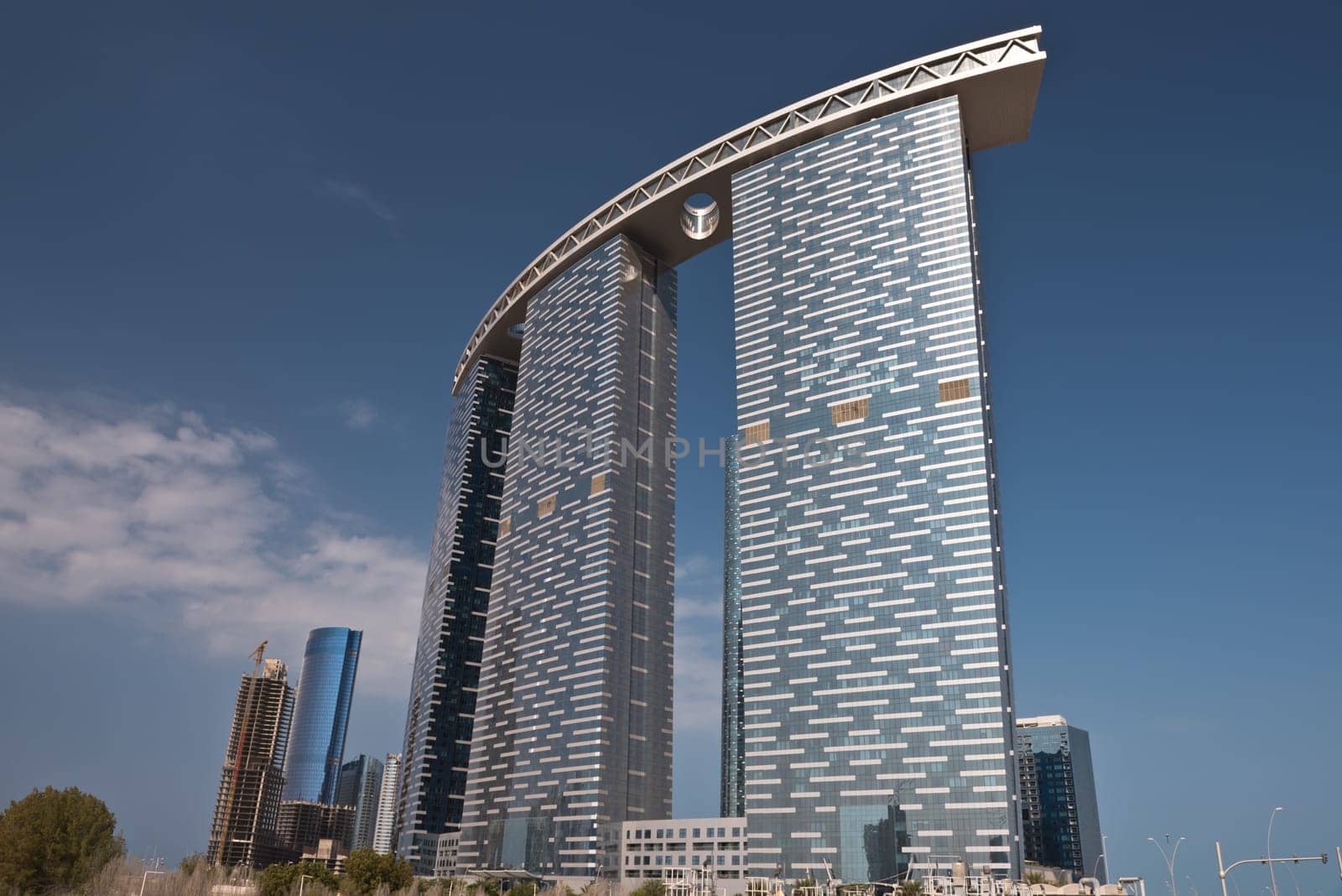 ABU DHABI, UAE - DECEMBER 24: Abu Dhabi streets with The Gate Towers skyscrapers on December 24, 2014. United Arab Emirates