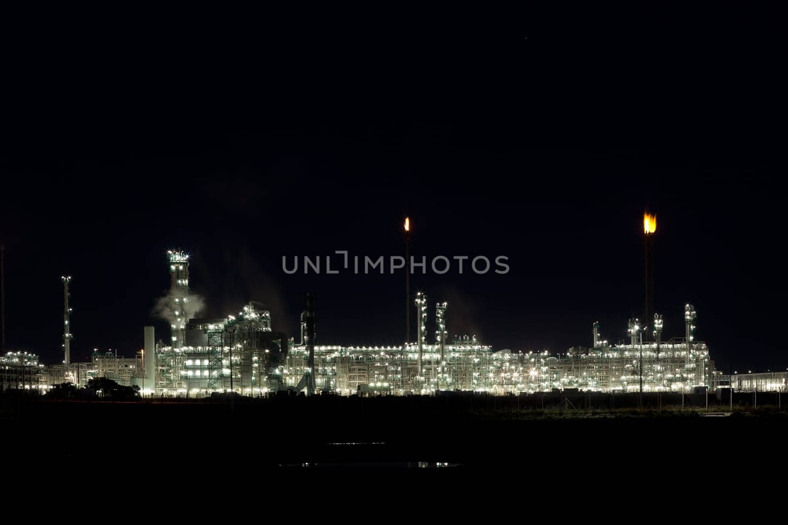 Night View of an Oil Refinery Plant. Horizontal shot