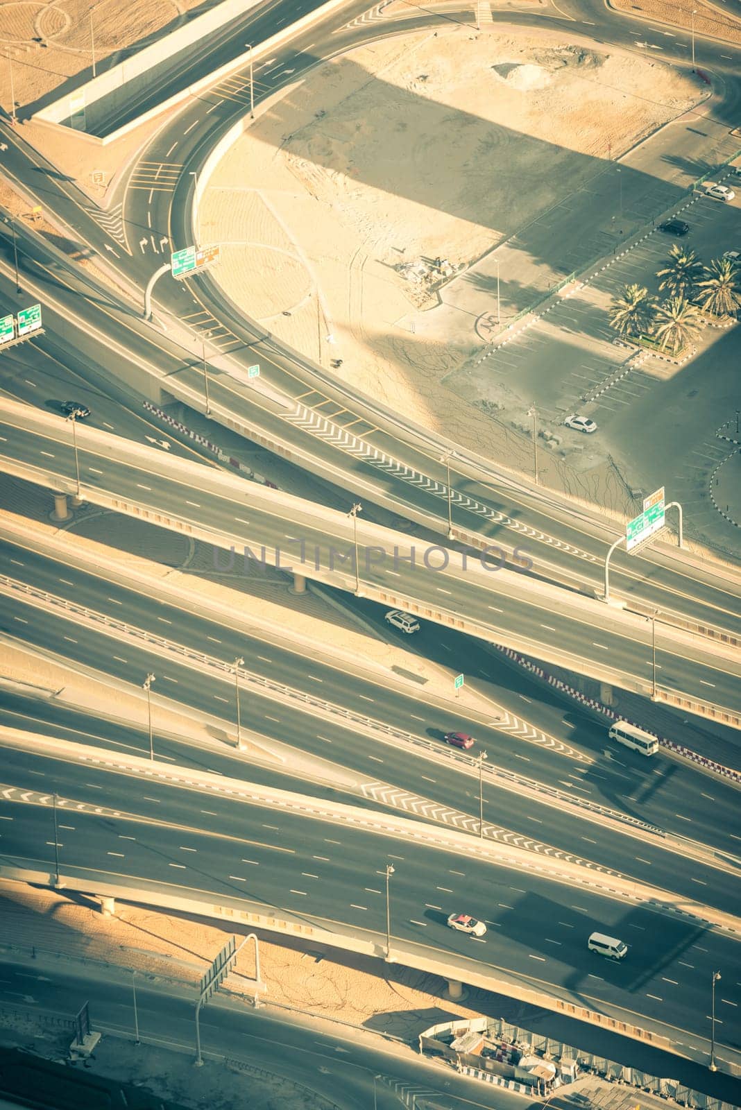 Top view of highway interchange in Dubai, UAE. Toned shot