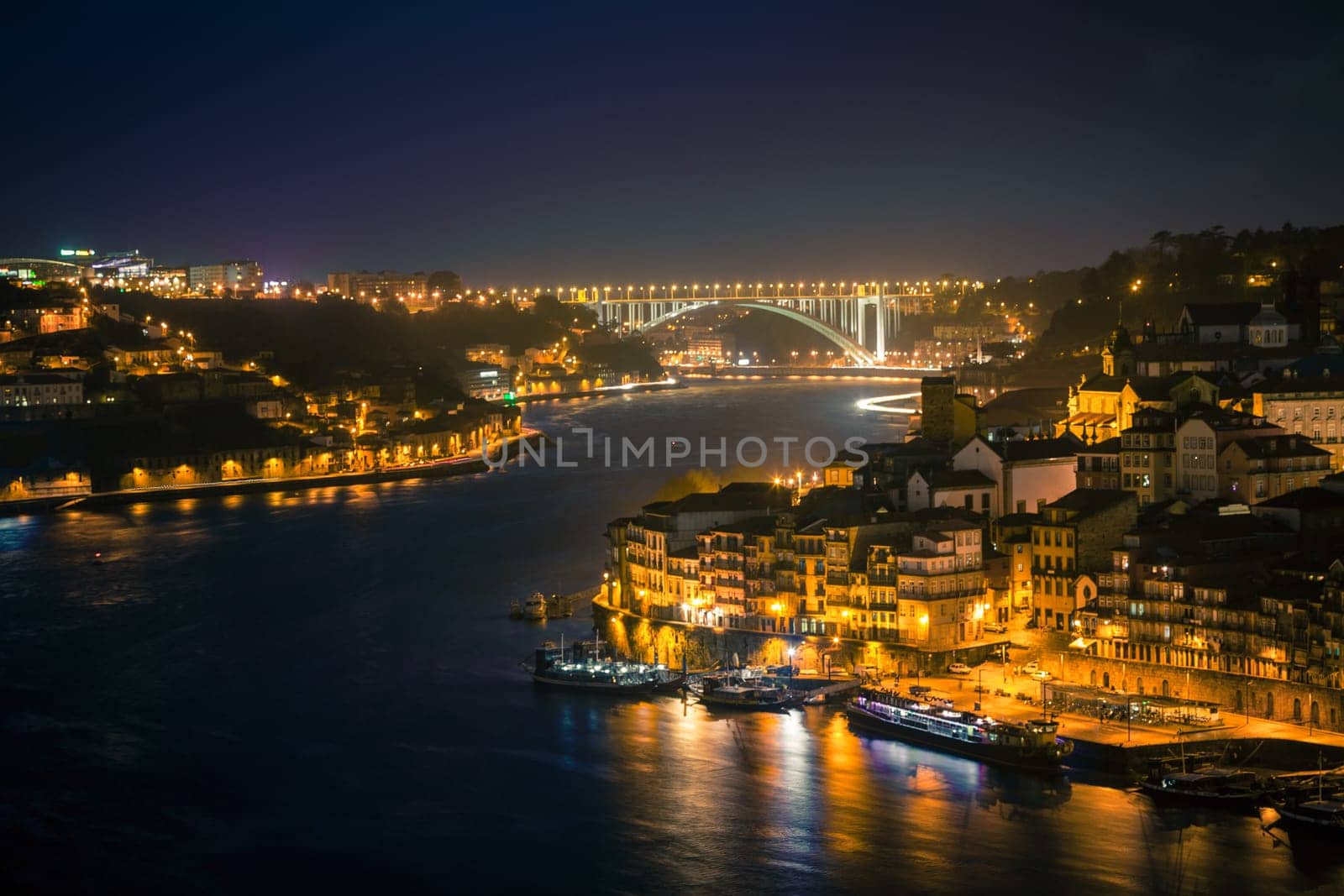 Overview of Old Town of Porto, Portugal at night. Horizontal shot